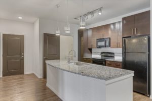 kitchen with large granite counter at gateway north